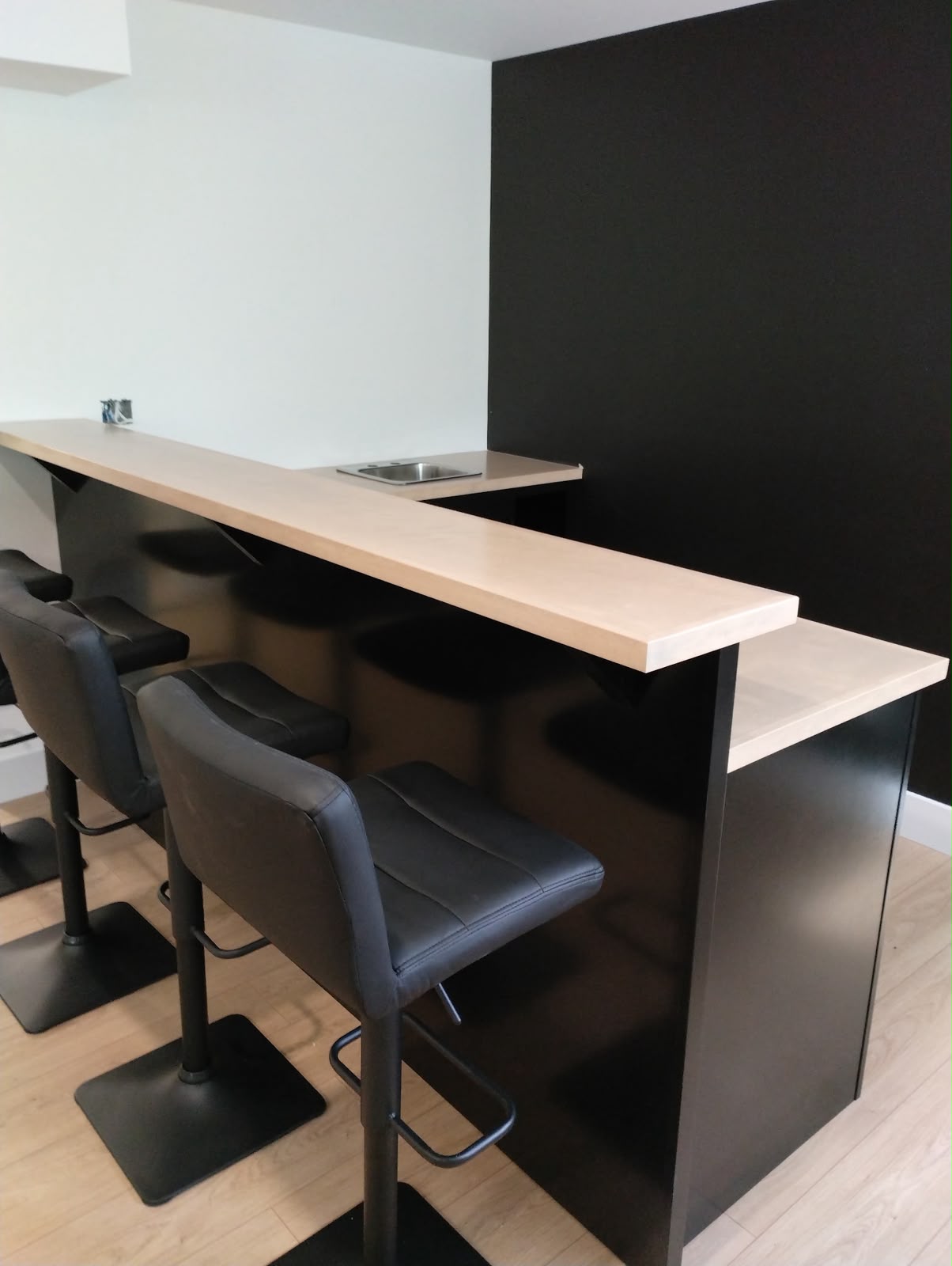 Custom built-in home bar with wood countertop