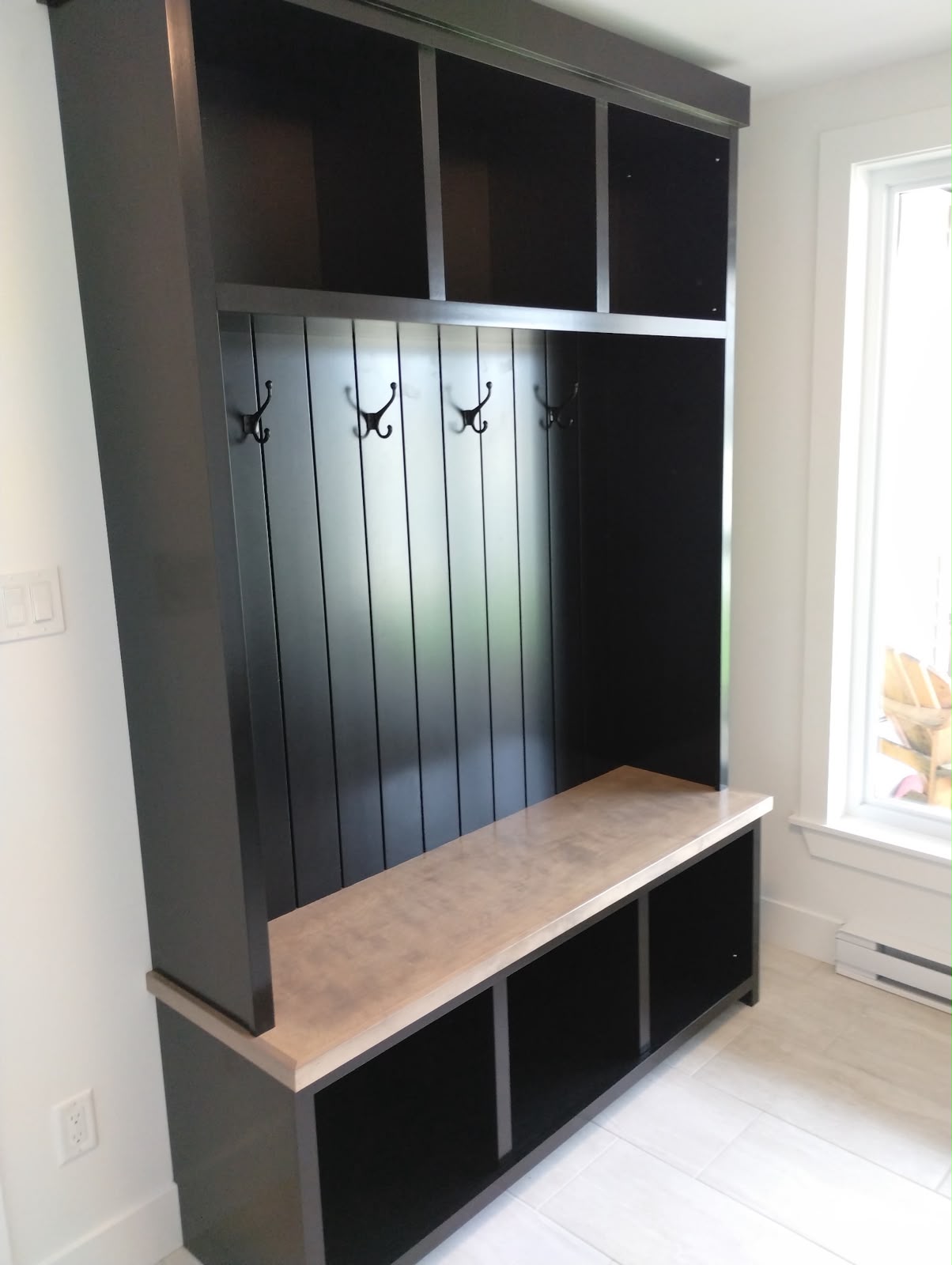 Custom black mudroom built-in by StairTrim Design